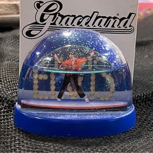 ELVIS SnowGlobe Graceland Box Figure poses w/ELVIS Marquee EPE Inc. Glitter snow